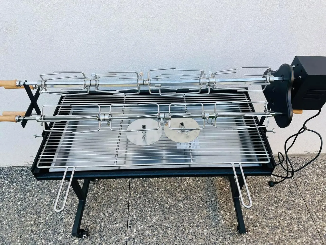 Motor-driven spit roast hire rig available in Adelaide with rotisserie forks